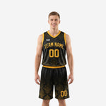 Custom black basketball uniform full set front and back view showing gold V-neck trim and damask pattern on jersey and shorts