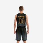 Back view of fully sublimated black basketball uniform with gold pinstripes and back player name and number zones