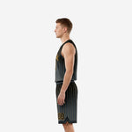 Left side view of black and gold sublimated basketball uniform set with V-notch hem shorts detail