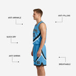 Close detail of sublimated diagonal swirl panel on black and sky-blue reversible basketball jersey showing contrast trim stitching