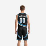 Side view of black and sky-blue reversible basketball uniform showing armhole binding and swirl panel transition across the jersey body