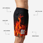 Back view of black custom basketball shorts showing flame sublimation continuing across the rear panel with elastic waistband detail