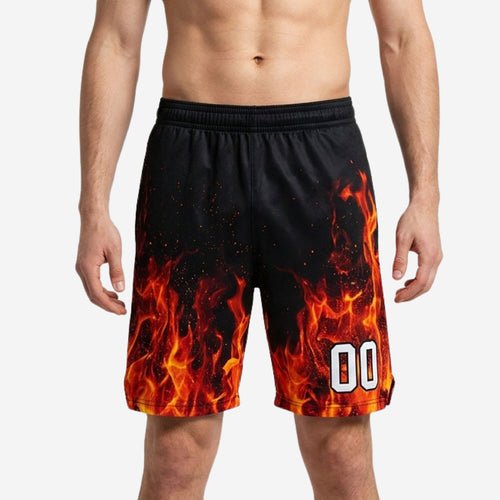Black custom basketball shorts with photorealistic orange-red flame sublimation rising from hem, player number 00 on right thigh, front view