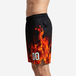 Opposite side view of black custom basketball shorts with sublimated orange and red flame design on 100 percent polyester performance knit