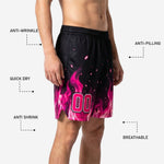 Back view of black sublimated basketball shorts with pink flame gradient pattern rising from the hem