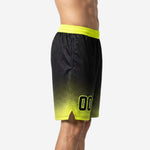 Black and neon yellow custom basketball shorts side view showing halftone dot gradient, side split at hem, and wide ribbed elastic waistband