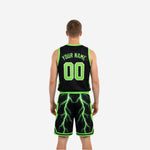 Side view of black and neon green reversible basketball jersey showing armhole binding and side panel lightning sublimation print