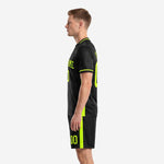 Custom soccer uniform in black and neon green, right side view showing halftone texture panel