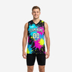 Black and neon paint splash sublimated basketball jerseys shown front and back on adult male model with custom team name and number 00