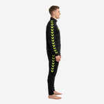 Black and gold soccer tracksuit left side profile showing full-length neon yellow chevron stripe on jacket sleeve and pant leg