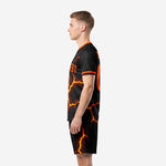 Alternate side view of custom sublimated black orange lava soccer uniform set
