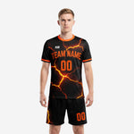 Custom black and orange lava sublimated futbol uniform kit front view with team name and number