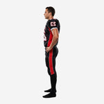 Side reverse view of black and red sublimated football jersey and pants showing set-in sleeve construction and pant stripe continuity