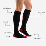 Toe box detail of custom red and black soccer socks showing red cushioned toe cap construction