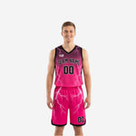 Black reversible basketball uniforms with pink lightning bolt gradient pattern showing both pink side and black side of the full 2-piece set