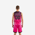 Side view of black reversible basketball uniforms showing armhole binding and side panel lightning bolt pattern detail
