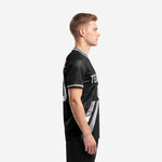 Left side view of black silver custom sublimation soccer shirt showing diagonal stripe panel