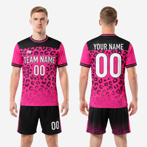 Black soccer shorts with hot pink side stripe and faded leopard print detail at hem matching the jersey kit