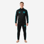 Front view of black and teal custom soccer tracksuit with geometric triangle side panels and teal chest number print on male model