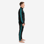 Side view of teal soccer tracksuit showing full-length teal geometric stripe running from shoulder to ankle on black jacket and pants