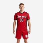 Front view of black trim custom red soccer uniform worn by male model showing white team name and number on chest