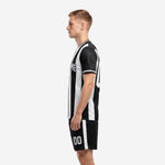 Custom black pinstripe soccer kit right side view with white stripe shorts
