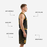 Close detail of black and gold sublimated basketball jersey showing V-neck collar binding and damask pattern across the chest panel