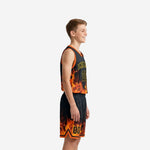 Front view of black youth basketball uniforms showing arched team name in gold, front number 00, and rising orange flame sublimated design