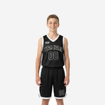 Custom black youth basketball uniforms two-piece set with white V-neck binding and arched team name on the front jersey and matching shorts with white hem trim