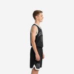 Front view of custom black youth basketball uniform showing arched team name across chest and white-outlined number 00 on solid black jersey with matching shorts