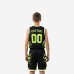 Opposite side view of black and neon green youth basketball uniform showing geometric sublimated panel detail