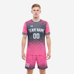 Blank soccer uniforms in hot pink and charcoal halftone gradient, front view full kit