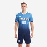 Blank soccer uniforms in sky blue to navy gradient with white V-neck and matching navy shorts, front view