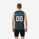 Opposite side view of custom blue and gray basketball jersey showing sleeveless cut and teal side stripe detail on performance polyester