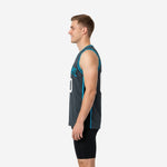 Side view of charcoal gray basketball jersey with vertical teal stripe running from armhole binding to straight hem