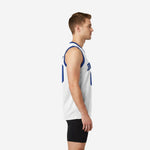 Men's custom blue and white basketball jersey front view showing royal blue armhole trim, arced team name, and centered front number on white performance knit