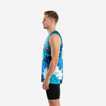 Side view of custom teal and navy blue and white basketball jersey showing continuous splash pattern on side panel and straight hem with teal trim