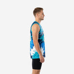 Custom blue and white basketball jersey in teal and navy splash design worn by adult male model, front view close-up