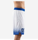 Side view of custom blue and white basketball shorts showing the halftone fade pattern, wide royal blue elastic waistband, and side split at the hem
