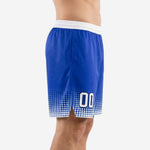 Custom royal blue basketball shorts showing halftone dot pattern rising from the white hem trim up the leg panel, side view