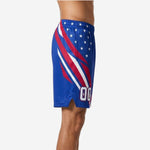 Left side view of royal blue custom basketball shorts showing diagonal crimson and white slash stripes sweeping down the outer leg panel