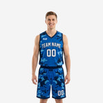 Blue and white basketball uniforms in royal blue digital-pixel camo with white arced team name and front number on sleeveless jersey and matching shorts