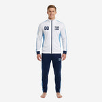 Front view of custom blue and white soccer tracksuit with player number 00 on chest and team logo placeholder, navy tapered pants with powder blue side panels
