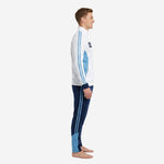 Left side view of mens blue and white soccer tracksuit showing powder blue contrast panels on jacket and navy track pants with stripe detail