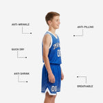 Full set view of youth sublimated basketball uniform in royal blue and white showing complete jersey and shorts with halftone dot gradient design