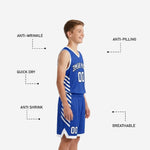 Opposite side view of blue and white custom youth basketball uniform showing shorts hem V-cut and side stripe detail