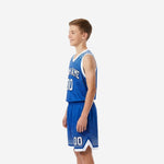 Opposite side view of royal blue and white youth basketball uniform set showing dot gradient pattern and white elastic waistband on basketball shorts