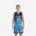 Custom blue and white youth basketball uniforms showing navy-to-sky-blue gradient jersey and matching sky-blue shorts with navy trim, front and back view