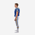 Opposite side view of blue and white sublimated youth American football uniform showing white jersey side panel and matching white pants with blue gold stripe