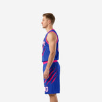 Blue and pink custom basketball jersey and shorts from opposite side showing claw-mark graphic extending across shorts leg and jersey lower panel, side view